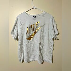 Women’s white and gold Nike t-shirt